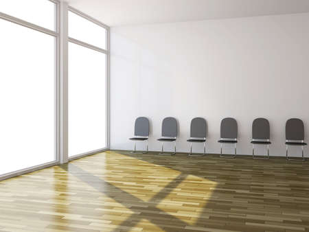 A few black chairs near the wallの写真素材