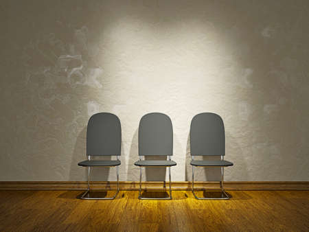 Three leather chairs near a cement wallの写真素材