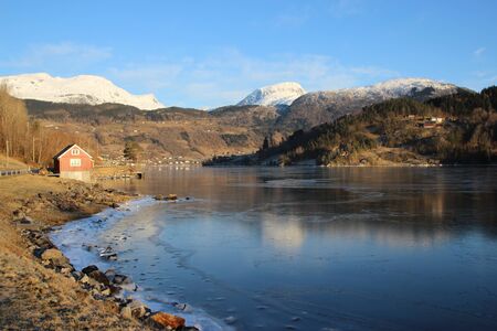 Snow mountain reflecting in Eidfjord Ulvik Norwayのeditorial素材
