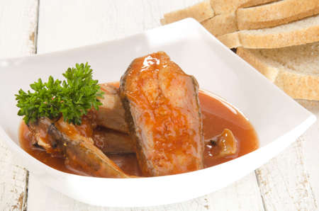 home made fish soup in a bowl and bread