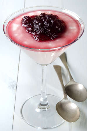 cocktail glass with custard and cranberry sauceの写真素材
