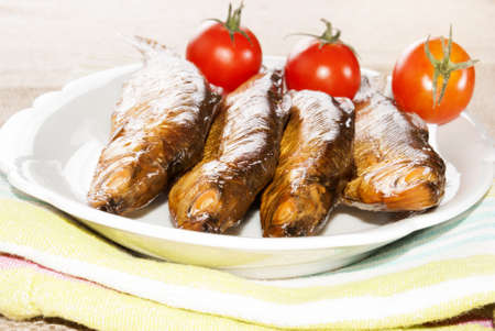 hot smoked whitefish and tomato on a plateの写真素材