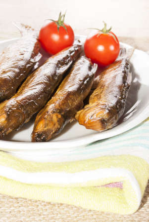 hot smoked whitefish and tomato on a plateの写真素材