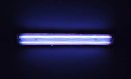 Detail shot of a fluorescent light tube on a wall with copyspace.の写真素材