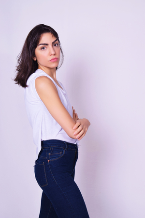 Portrait of beautiful hispanic woman. Latina model isolated over grey background.の写真素材