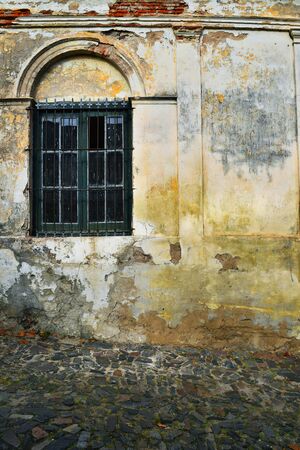 Closeup of old grunge window at Colonia, Uruguay. Facade of colonial house.の写真素材