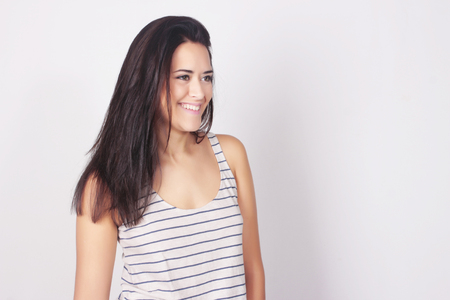 Portrait of beautiful carefree young woman, isolated over white background. Caucasian woman smiling.の写真素材
