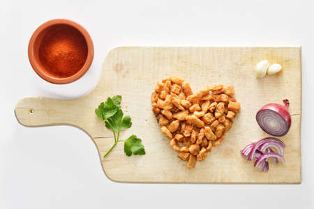 They say  a way to a man s heart is through his stomach   Perhaps some crisp pork rinds will do the trick の写真素材