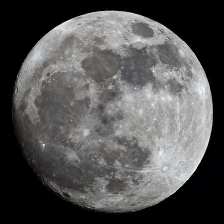 Almost full Moon taken with a powerful telescope with visible color variations on the surface の写真素材