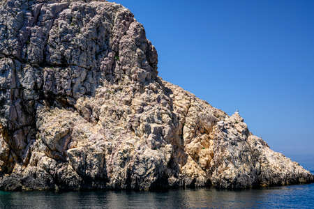 St. Grgur is a small croatian island with harsh, but beautiful cliffs. The rocks have cracked by the constant heating of the sun.の写真素材