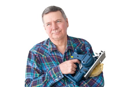 Portrait of mature DIYer with circular saw, isolated on a white background.