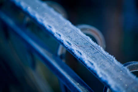 Iron railing covered with morning frost