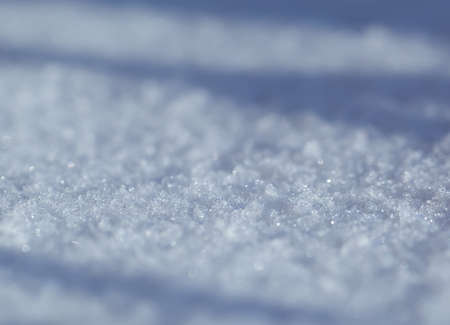 Snow background white in winter day. Season of Cold weather. Crystal snowflake texture.の写真素材