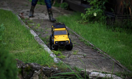 June 13 2020 Moscow.Russia. Male kid Toys. Radio controlled wireless drive. Toys with remote control. Free time. Children and adults concept. Model off-road car.のeditorial素材