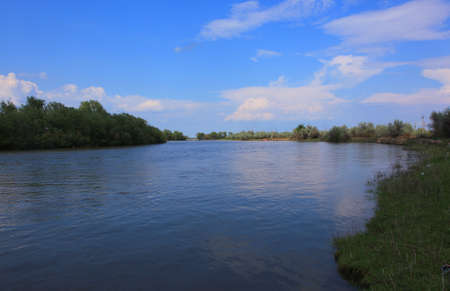 A natural blurred landscape of the river in autumn at sunset. Astrakhan Region, Russia
