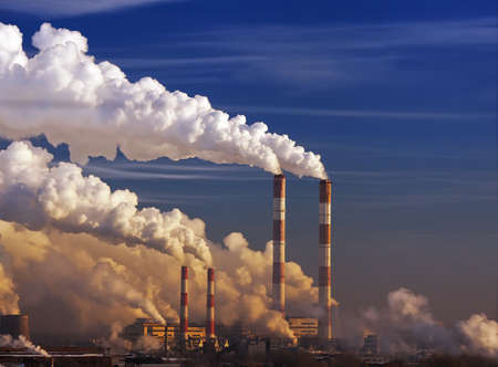 smoking chimneys. Environmental problem of pollution of environment and air in large cities.Climate change,ecology and global warming. Soot from factories. Thermal power plant in Moscow.の写真素材