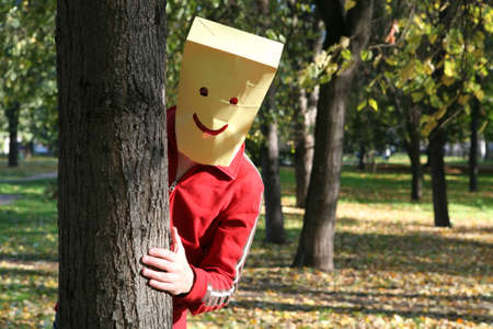Merry Funny Smiling Man appeared from behind the Tree, Fun, Humorの写真素材