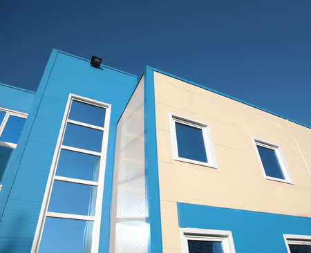 fragment of the new building on background blue sky
