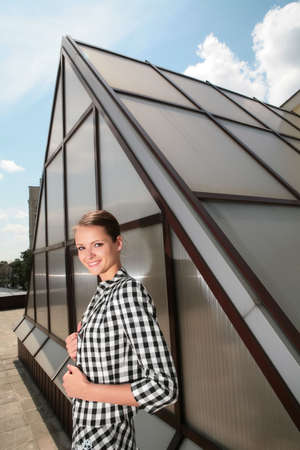 young architect on background of the metallic-glass modern constructionの写真素材