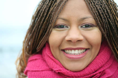 close-up portrait smiling attractive of the young woman with red scarf