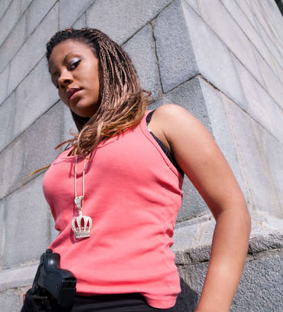 very serious gangster girl with gunの写真素材