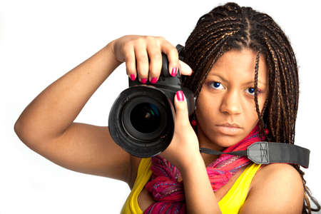 beautiful black woman with camera on the white backgroundの写真素材