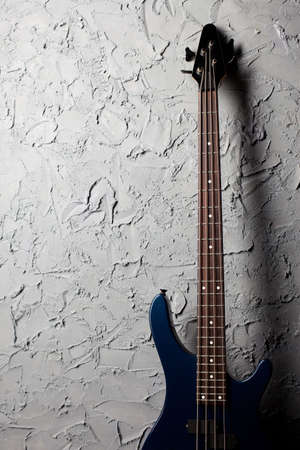 guitar stands near the gray wallの写真素材