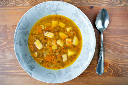 buckwheat soup with potatoes and carrots in a bowl
