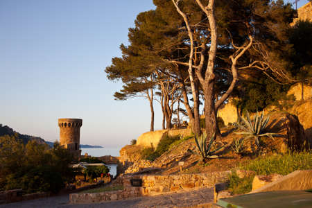 sunset over the old fortress in Tossa de Marの写真素材