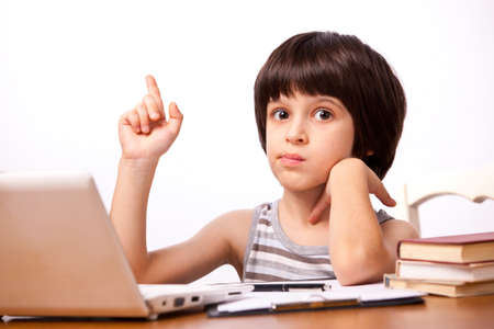 boy with his finger up, guess. on the white background