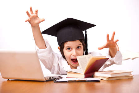 expression little boy in hat with computer and textbooks on white background 