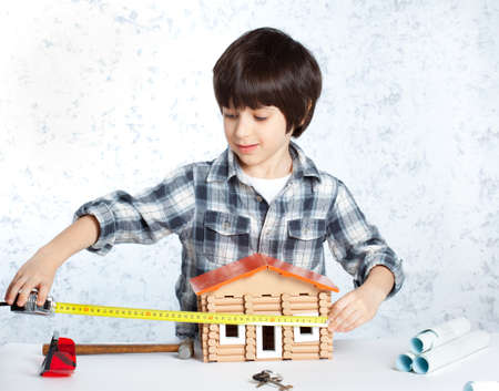 boy builder tape measure homeの写真素材