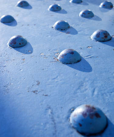 metal rivets on the surface, close-upの写真素材