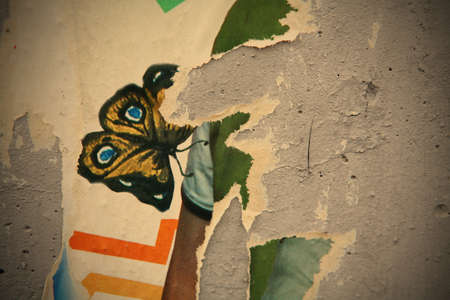 Texture, Varicolored Concrete Wall with Scrap of the Posters and Announcementsのeditorial素材