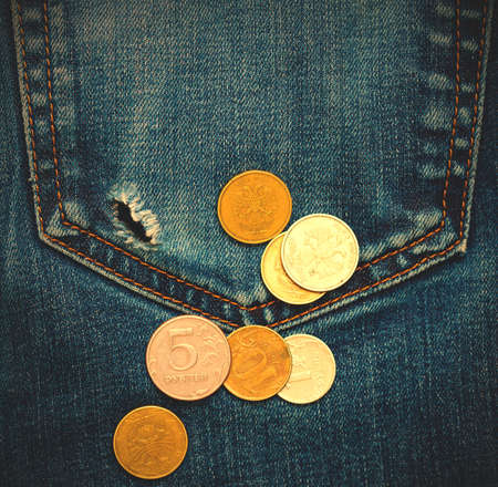 jeans pocket with hole and russian coins.の写真素材