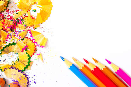 Four colored pencils and shavings on white background with copy space.の写真素材