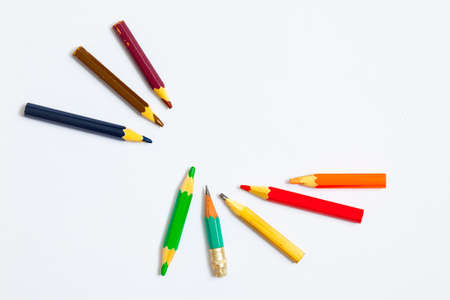 several vintage pencils on a white background, close-up.