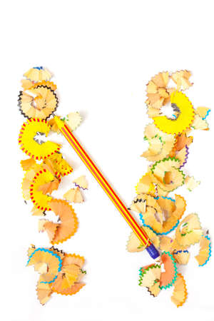 Photo of Letter N from colored shavings on white backgroundの写真素材