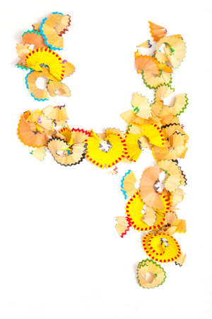 Photo a Letter of Russian Alphabet  from colored shavings on white backgroundの写真素材