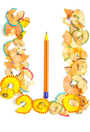 Photo a Letter of Russian Alphabet  from colored shavings on white backgroundの写真素材