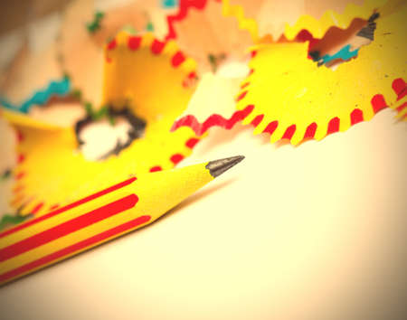 colored pencils and shavings on white background with copy space. instagram image retro style