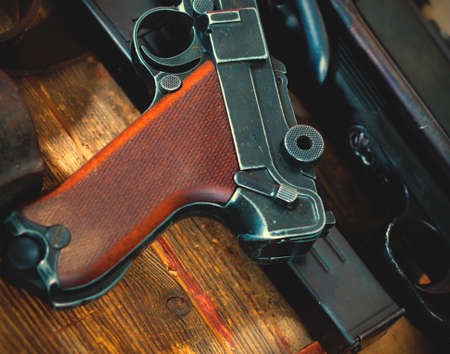 Luger Parabellum pistol and submachine gun MP 38 in gunsmith on table in a gunsmith.の写真素材