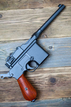 vintage submachine gun Mauser on old textured boardsの写真素材