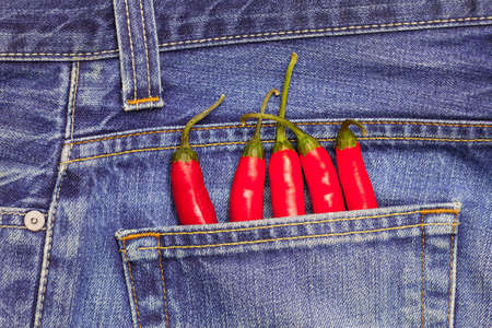red hot chili peppers in a jeans pocketの写真素材