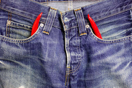 vintage blue jeans with red hot chili peppers in the pocketsの写真素材