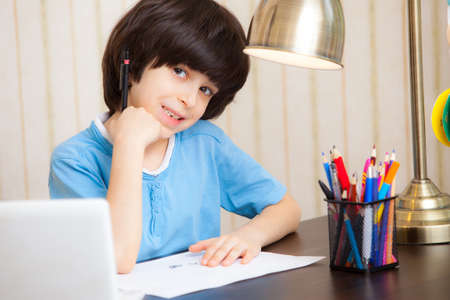 child doing homework, portrait