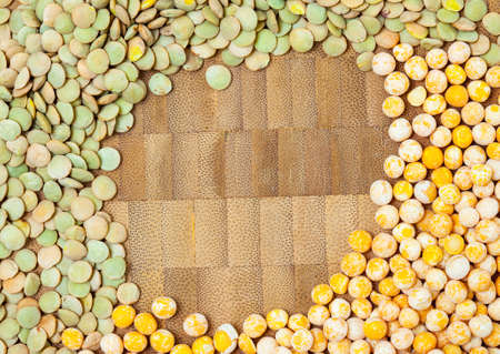 dry peas and lentils on a cork background with copy space