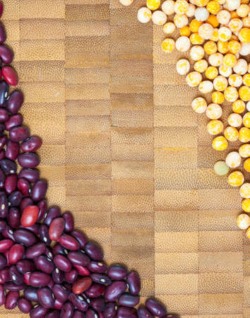green pea and red bean on cork surface, close up