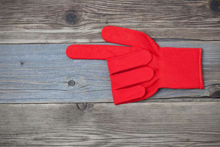 red construction glove forefinger pointsの写真素材
