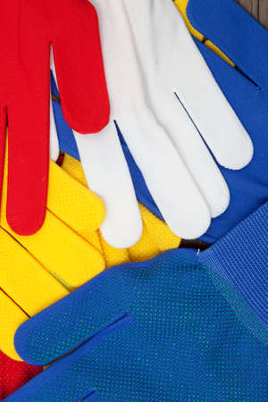 new colored work gloves on the display of shop